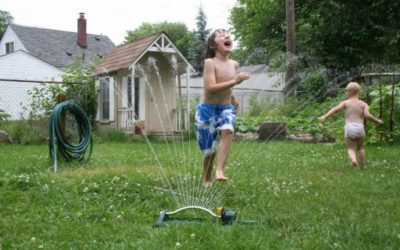 kids playing in backyard with mosquito prevention program