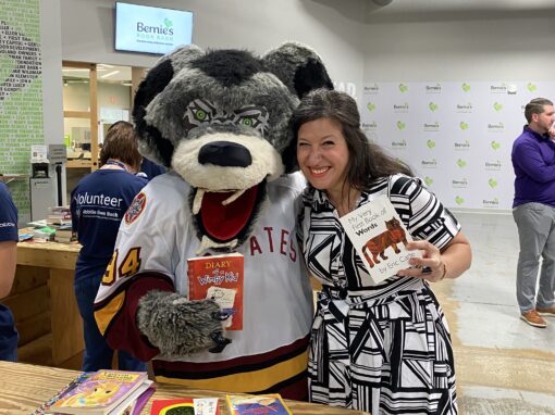 Skates Chicago Wolves mascot and Janelle Iaccino Marketing Director for Rose at Bernie's Book Bank