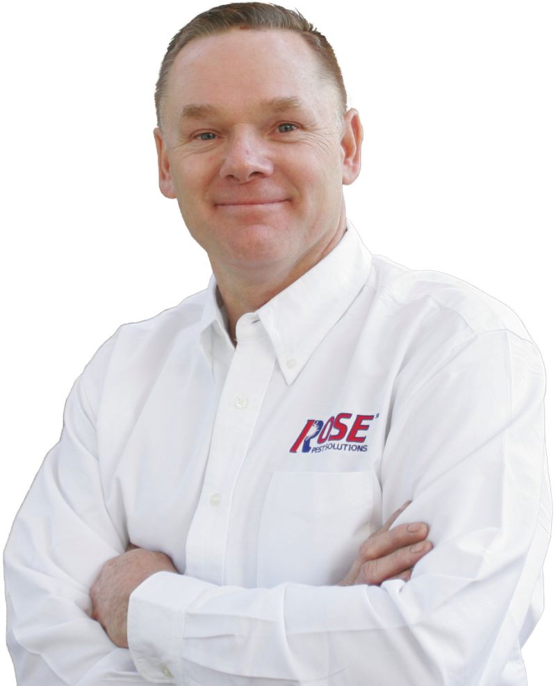 Rose Pest Solutions tech in white button up shirt