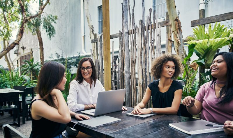 Women having outdoor business meeting